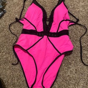 Becca got pink one piece with cut out
